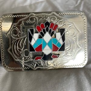 Vintage nickel silver thunderbird buckle on a bechelli leather belt